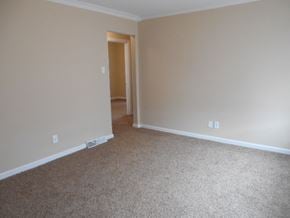 Florissant house for rent - A room with carpeted floor and a doorway leading to another room.