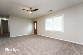 Conyers house for rent - A room with a ceiling fan and a door.