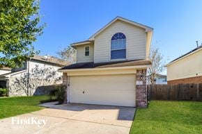 Houston house for rent - the front of a white house with a white garage door