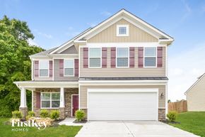 Mcleansville house for rent - a house with pink shutters and a white garage door