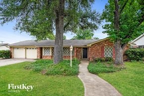 Hurst house for rent - A brick house with a tree in front of it.
