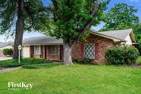 Hurst house for rent - A brick house with a tree in front of it.