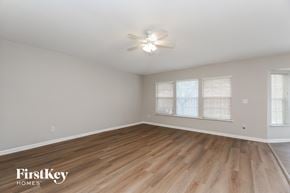 St. Augustine house for rent - A room with wooden flooring and a ceiling fan.