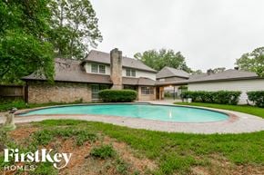Houston house for rent - A house with a pool in the backyard.