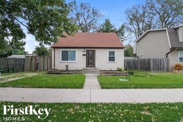 Midlothian house for rent - a small white house with a yard and a sidewalk