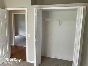 North Port house for rent - an empty bedroom with a closet and an open door
