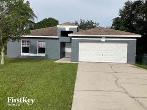North Port house for rent - a blue house with a white garage door