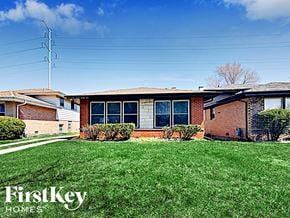 Dolton house for rent - a small brick house with green grass in front of it