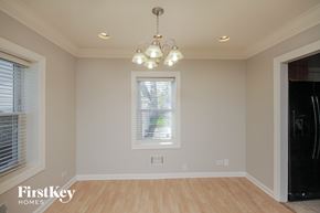 Midlothian house for rent - a dining room with a chandelier and a window