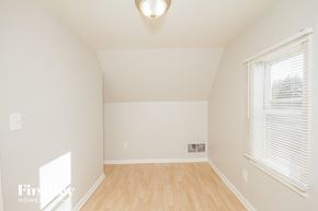 Midlothian house for rent - a living room with white walls and a window and a wooden floor