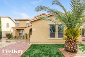 Surprise house for rent - a palm tree in front of a house