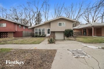 Dolton house for rent - a house with a sidewalk and a driveway in front of it