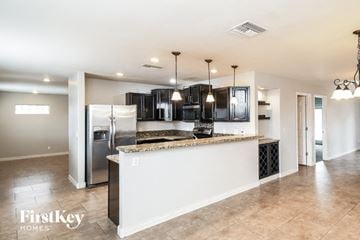 Mesa house for rent - A kitchen with a white counter and a refrigerator.