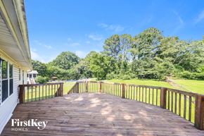 Birmingham house for rent - a deck overlooking a yard with trees and a blue sky