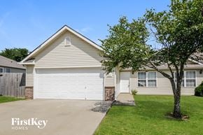 Pleasant Hill house for rent - a white garage door in front of a house