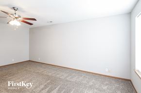 Pleasant Hill house for rent - an empty room with a ceiling fan and a carpet