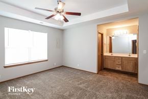 Pleasant Hill house for rent - the master bedroom has a large window and a large vanity