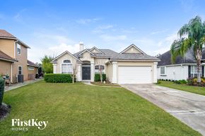Fleming Island house for rent - A house with a well-maintained lawn and a clear sky above.