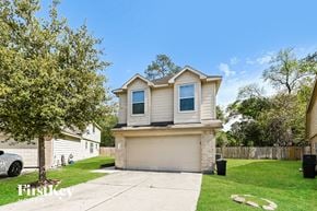Houston house for rent - a tan and with a driveway and a tree