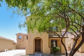 Surprise house for rent - a house with a tree in front of it