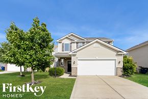Noblesville house for rent - A house with a tree in front of it and the words "FirstKey Homes" on the bottom left.