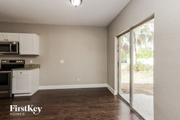 North Port house for rent - A kitchen area with a microwave and oven on the counter.