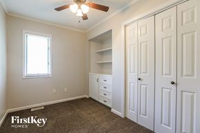 Belton house for rent - a bedroom with two closets and a ceiling fan
