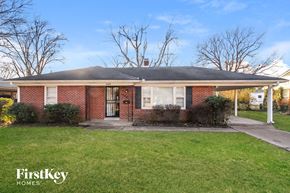 Memphis house for rent - a small brick house with a lawn in front of it