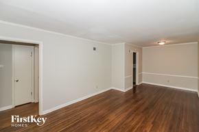 Memphis house for rent - a living room with wood floors and white walls
