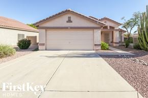 Surprise house for rent - a home with a driveway and a garage door