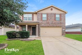Cypress house for rent - a house with a driveway and a garage door