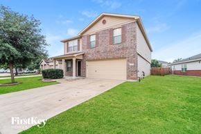 Cypress house for rent - a house with a driveway and a lawn