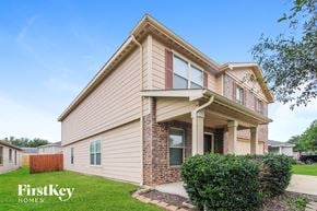 Cypress house for rent - a house with a lawn and a sidewalk in front of it