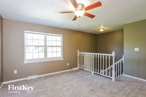 Independence house for rent - the master bedroom has a large window and a ceiling fan