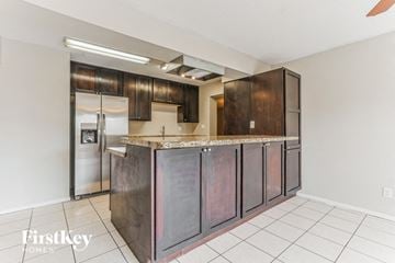 Tempe house for rent - a kitchen with stainless steel appliances and a counter top