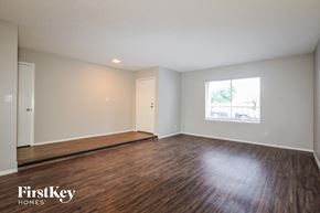 Glendale house for rent - the living room with hardwood flooring and a window