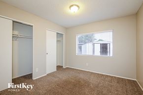 Glendale house for rent - a bedroom with carpet and a window and a closet