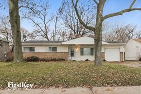 Markham house for rent - a white house with two trees in front of it