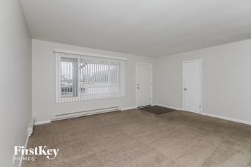 Markham house for rent - a living room with carpet and a window and a door