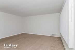 Markham house for rent - a bedroom with a carpeted floor and white walls