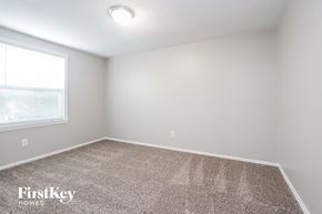 Indianapolis house for rent - the upstairs bedroom has carpet and a large window