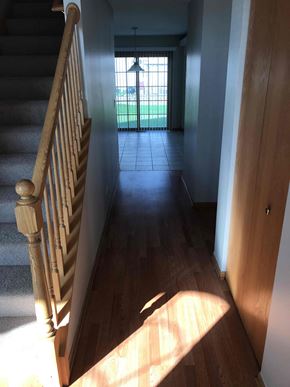 Crest Hill house for rent - a hallway with a staircase and a door into a house