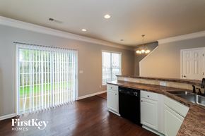 Kennesaw house for rent - a kitchen with a large window and a sink and a counter top