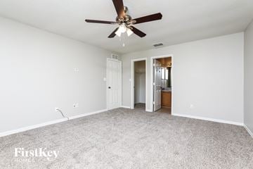 Winter Garden house for rent - a spacious living room with carpet and a ceiling fan