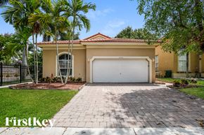 Homestead house for rent - a home with a driveway and a garage door