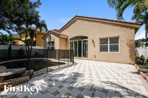 Homestead house for rent - a house with a pool in front of it