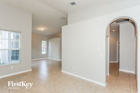Homestead house for rent - the living room and dining room with arched doorways