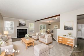 Westfield house for rent - A living room with a fireplace and a couch.