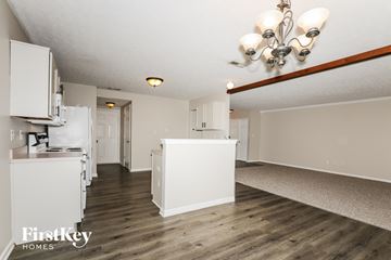 Westfield house for rent - A kitchen area with a white cabinet and a wooden floor.