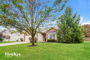 Noblesville house for rent - A house with a tree in front of it.